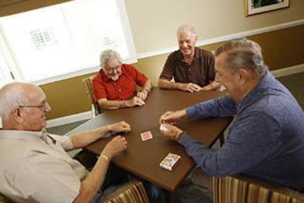 seniors playing cards at Discovery Commons At Bradenton in Bradenton, Florida