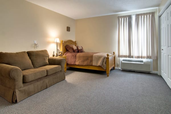 Assisted living apartment bedroom at Dunsford Court in Sullivan, Missouri