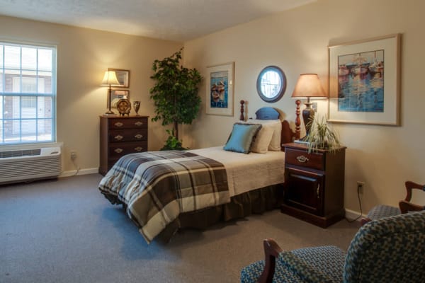 Assisted living apartment bedroom at RiverWick in Savannah, Tennessee