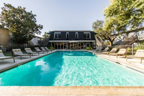 Swimming pool and patio furniture at Willowick Apartments in College Station, Texas