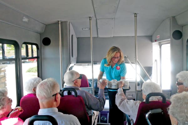 Residents being handed mugs on the bus at Scholl Canyon Estates in Glendale, California