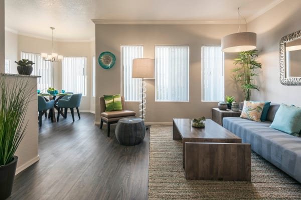 Modern living room with hardwood floors at Mira Santi in Chandler, Arizona