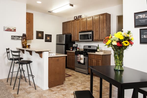 Dark wood cabinets in the kitchen at Villa Risa Apartments in Chico, California
