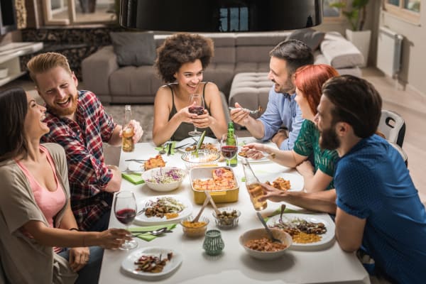 Residents enjoying dinner with friends in the neighborhood near Echelon Luxury Apartments in Cincinnati, Ohio