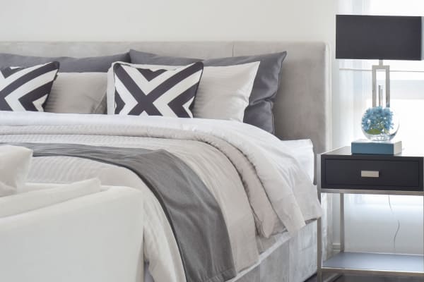 A well decorated bedroom with a bed and nightstand at Smith & Porter in Atlanta, Georgia