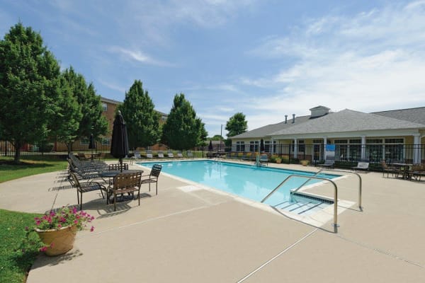 Swimming pool on a sunny day at Hill Brook Place Apartments in Bensalem, Pennsylvania
