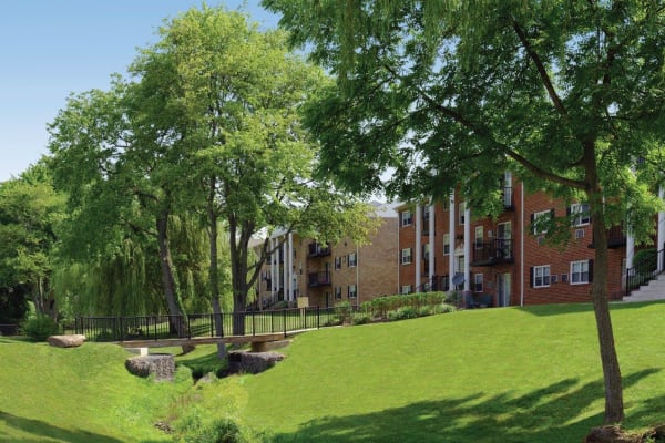 Landscaped grounds around Hill Brook Place Apartments in Bensalem, Pennsylvania