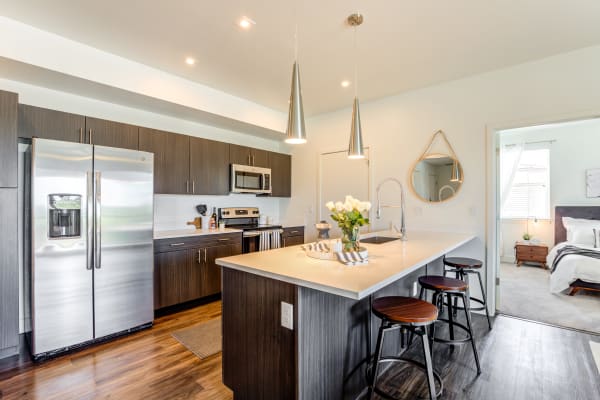 Couple having a drink in their new The Wyatt home in Fort Collins, Colorado