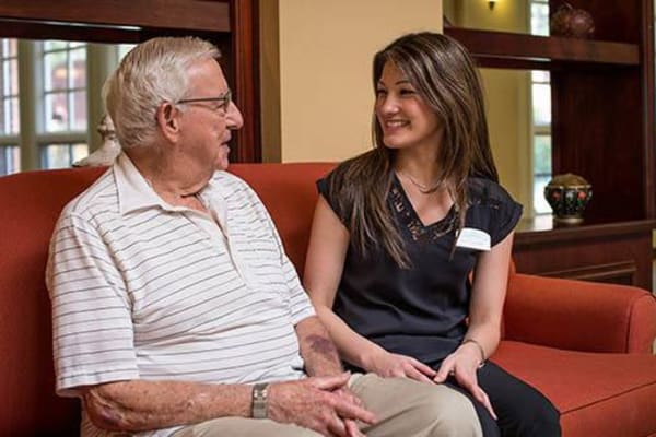 Resident and nurse talking at WellQuest of Menifee Lakes in Menifee, California