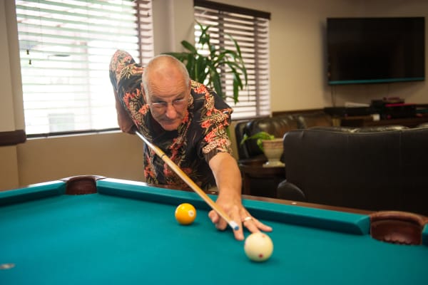 Man playing pool at Westmont Village in Riverside, California