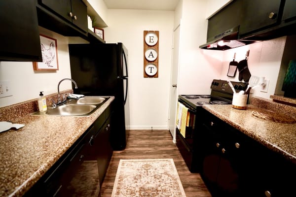 Modern kitchen at Newport Oaks Apartments in Alvin, Texas