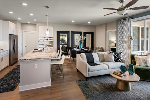 Beautiful open-concept layout with hardwood floors in a model home at The Halsten at Chauncey Lane in Scottsdale, Arizona