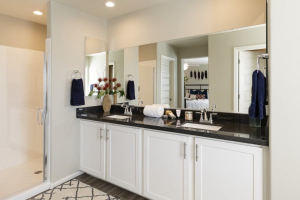 Resident relaxing in bedroom at BB Living at Val Vista in Gilbert, Arizona