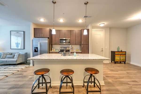 Modern kitchen and dining area at Luxor Club in Jacksonville, Florida