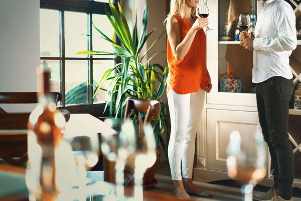 Residents talking over a glass of wine in a luxury home at Sanctuary on 51st in Laveen, Arizona