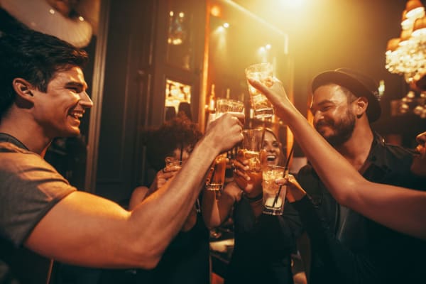 Group of friends having drinks at a neighborhood bar near Banyan on Washington in Phoenix, Arizona