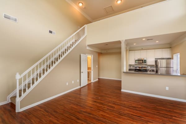 Living room with stairs to second floor at The Waterfront Apartments & Townhomes in Munhall, Pennsylvania