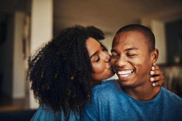 Happy couple in their new home at Parc at Flowing Wells Apartment Homes in Augusta, Georgia