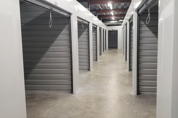 Well-lit hallways at Top Self Storage in West Palm Beach, Florida. 