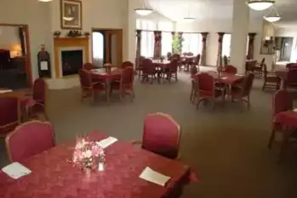 Elegant red dining room at Avalon Assisted Living Community in Fitchburg, Wisconsin
