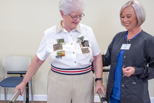 A staff member helping a resident with physical therapy at Fair Haven in Birmingham, Alabama. 