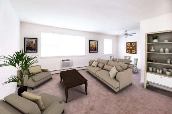 Spacious living room and dining area with plush carpeting in a model apartment home at Scudder Falls in Ewing, New Jersey