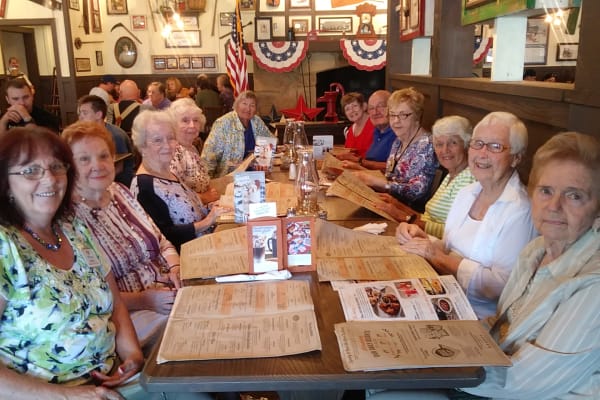 Residents from Mathison Retirement Community and their family having dinner at a local restaurant in Panama City, Florida
