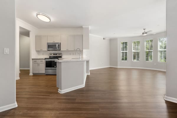 Beautiful open layout of kitchen and living room with hardwood-like flooring at  Park Central in Concord, California