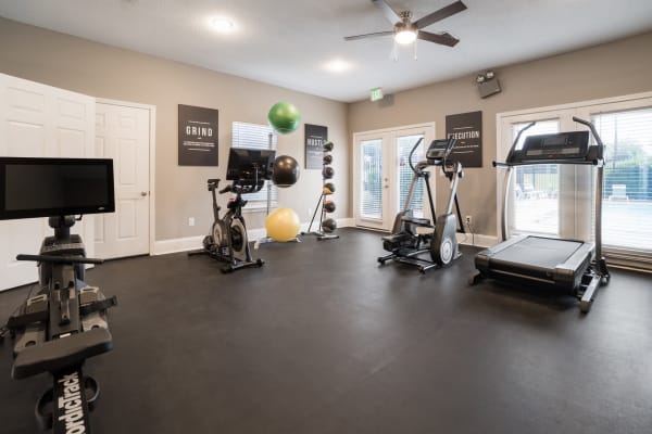 Fitness center with exercise equipment at The Pointe at Boardwalk in Jackson, Tennessee