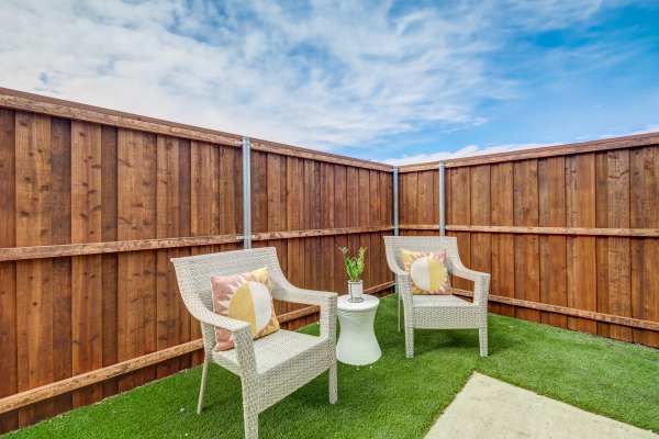 Lawn chairs in a back yard