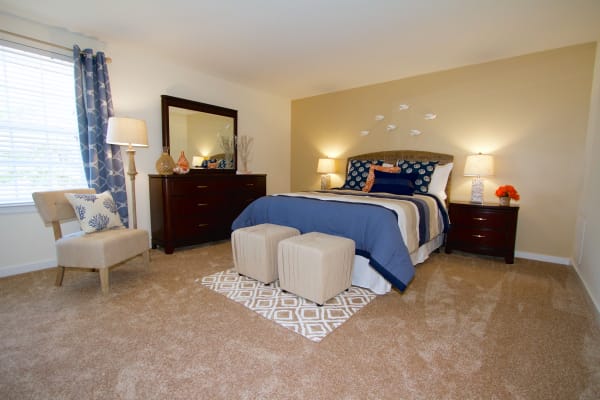 cozy blue bedroom at Aspen Apartments in Virginia Beach, Virginia
