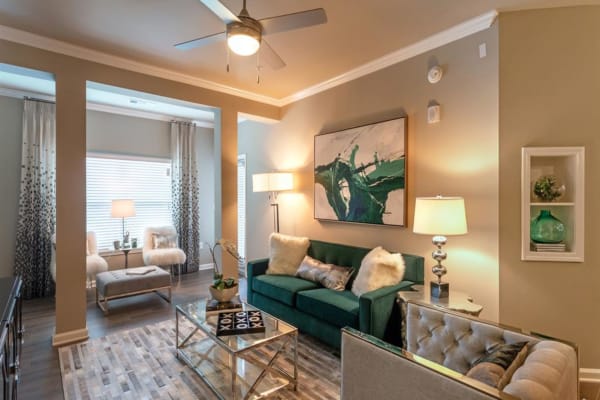 A comfortable, furnished apartment living room at Lullwater at Blair Stone in Tallahassee, Florida