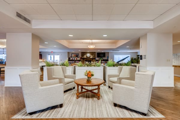 Resident lounge with cozy fireplace at Vancouver Pointe in Vancouver, Washington.