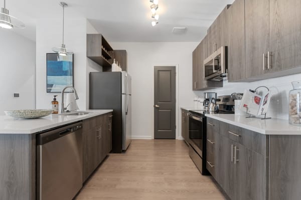 Stainless steel appliances in an apartment kitchen at The Station at Clift Farm in Madison, Alabama