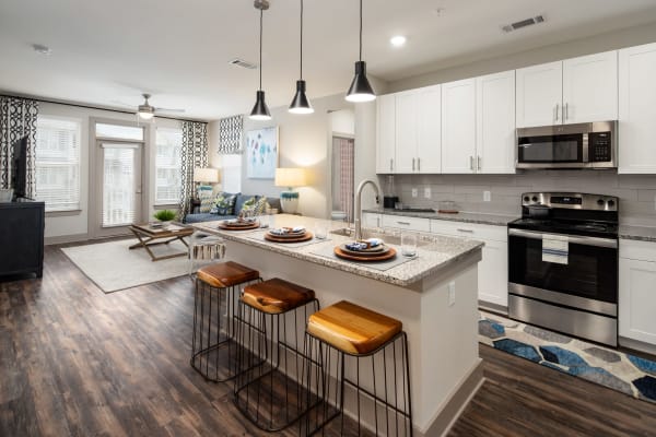 A comfortable apartment kitchen and dining room at The Highland in Augusta, Georgia