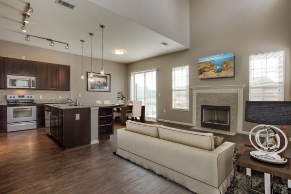 modern kitchen and open layout in a model apartment at Parkside Towns in Richardson, Texas