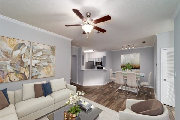 A comfortable, furnished apartment living room and dining room at Astoria in Mobile, Alabama