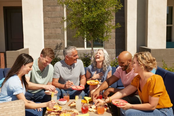 Happy family enjoying the weather and having food near BB Living at Val Vista in Gilbert, Arizona