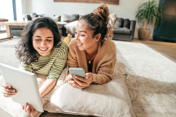 Residents comparing notes on their tablet at Fox Pointe in Hi-Nella, New Jersey