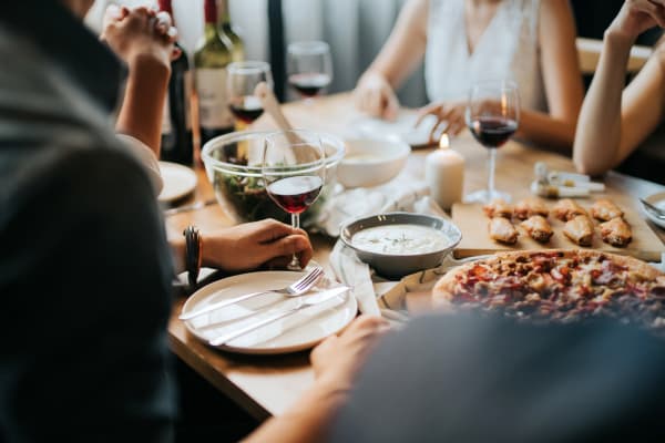 Residents sharing a meal and a glass of wine near Holly Court in Pitman, New Jersey