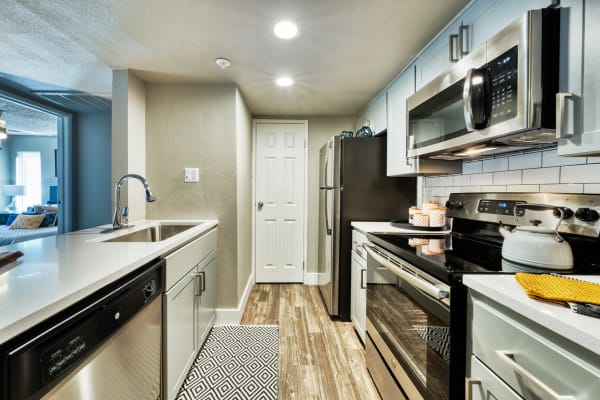 Kitchen with stainless-steel appliances at Asteria Apartments in Tempe, Arizona