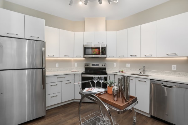 Model kitchen with white cabinets at Town Court in West Bloomfield, Michigan