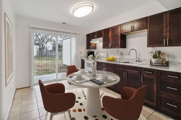 Spacious, modern kitchen with a sliding glass door at Overlook Manor Townhomes in Frederick, Maryland