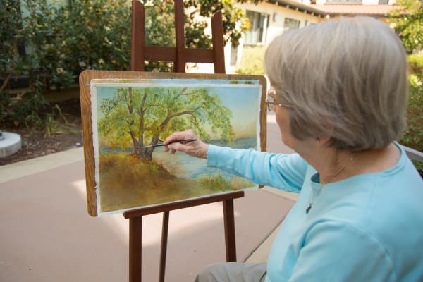 A resident painting at Merrill Gardens at Hillsboro in Hillsboro, Oregon. 
