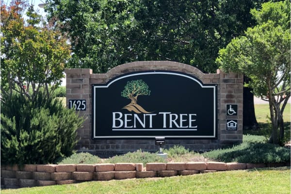 Happy resident and her pup at Bent Tree Apartments in San Angelo, Texas