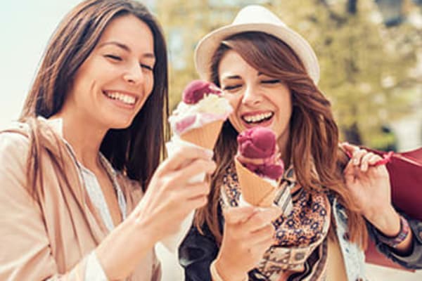 Happy friends having ice cream near Hidden Creek in Vacaville, California