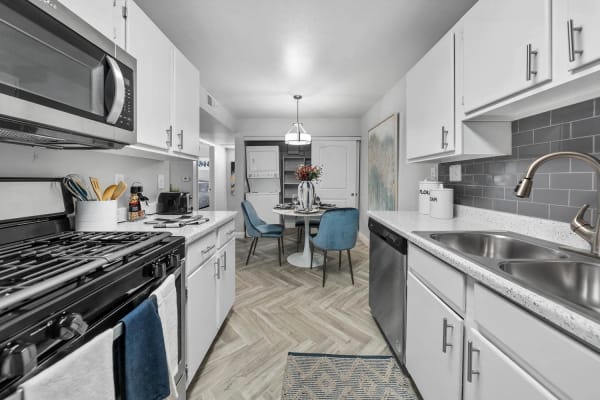 Model kitchen with white cabinets at District 5800 in Las Vegas, Nevada