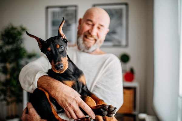 Happy puppy and her owner in their new home at Mariposa at Cedar Park in Cedar Park, Texas