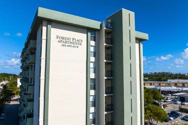 Signage on the side of an apartment building at Forest Place in North Miami, Florida