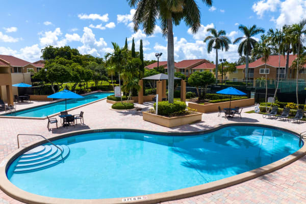 One of the sparkling swimming pools at Azalea Village in West Palm Beach, Florida